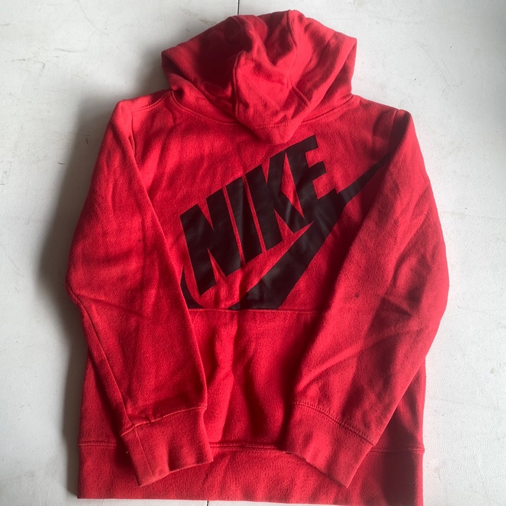 Size 7 nike red with black sweatshirt. Small dark spots on back of sleeves.